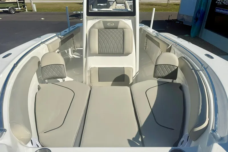 Slide: The Image of 2026 Key West 244 Center Console boat with modern helm and seating under clear blue sky. - 13
