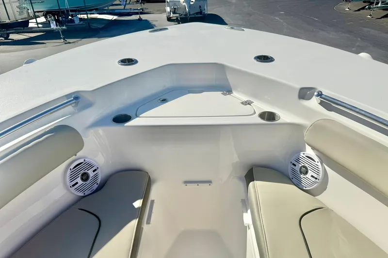 Slide: The Image of 2026 Key West 244 Center Console boat displayed outdoors on a sunny day. - 15