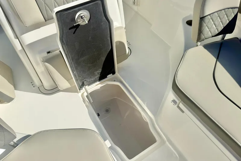 Slide: The Image of 2026 Key West 244 Center Console boat interior with seating and table. - 18