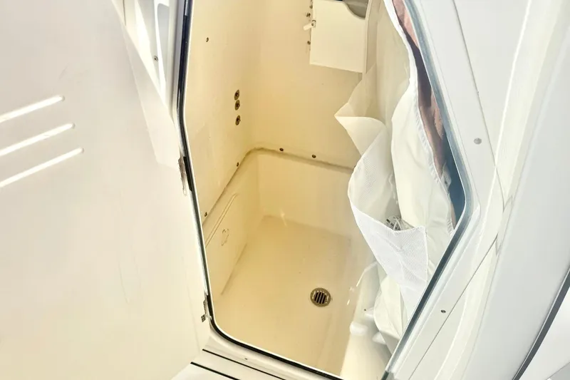 Slide: The Image of 2026 Key West 244 Center Console boat interior with cushioned seating and modern design. - 24