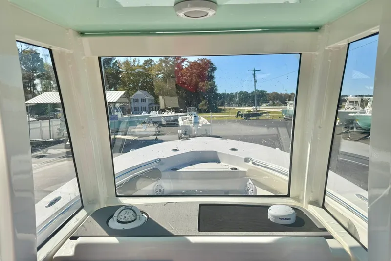 Slide: The Image of 2026 Key West 244 Center Console boat seat with quilted design and KW logo. - 26