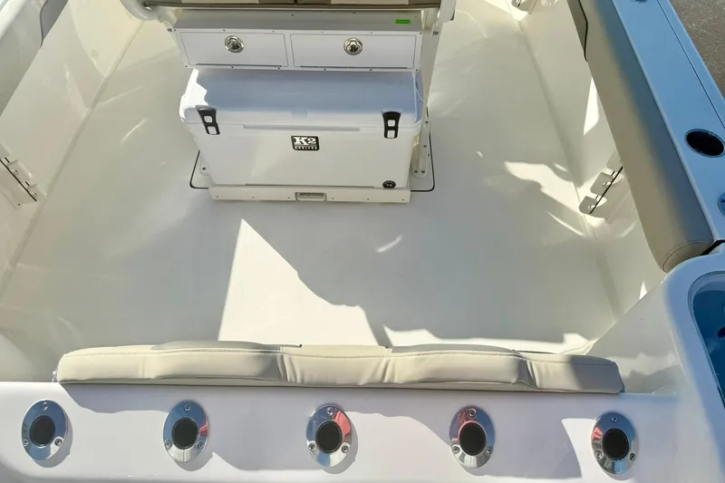 Slide: The Image of 2026 Key West 244 Center Console storage compartment interior view. - 31