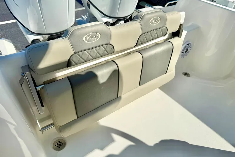 Slide: The Image of 2026 Key West 244 Center Console boat top view with rod holders, clear sky background. - 34