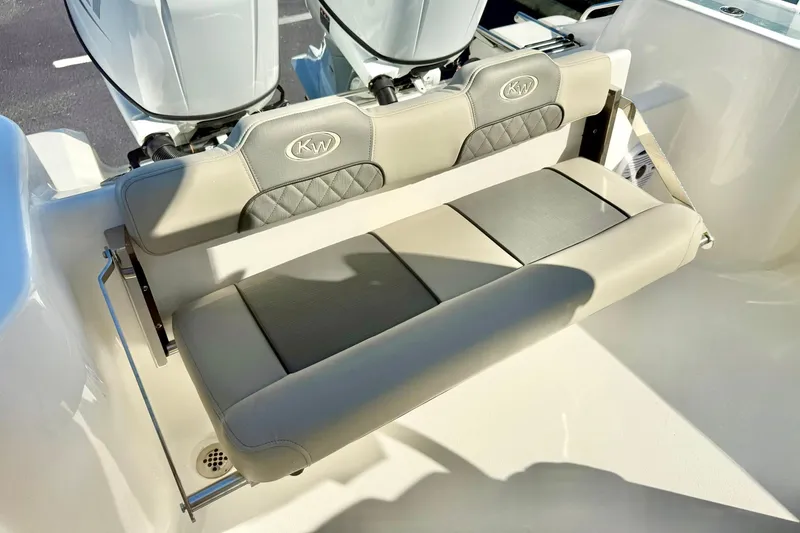 Slide: The Image of 2026 Key West 244 Center Console boat interior with overhead storage and lighting. - 35