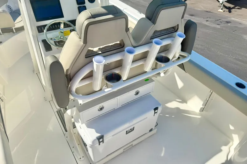 Slide: The Image of 2026 Key West 244 Center Console boat interior with rod holders and seating. - 39