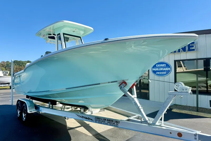 Slide: The Image of 2026 Key West 244 Center Console boat on trailer, displayed outdoors. - 4