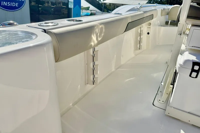 Slide: The Image of 2026 Key West 244 Center Console boat interior with sleek seating and cup holders. - 44
