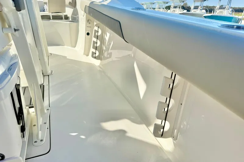 Slide: The Image of 2026 Key West 244 Center Console boat interior, showcasing sleek white design and seating area. - 45