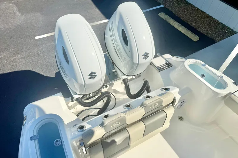 Slide: The Image of 2026 Key West 244 Center Console boat with dual Suzuki outboard engines. - 48