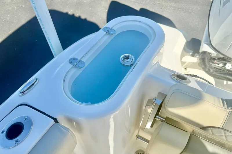 Slide: The Image of 2026 Key West 244 Center Console boat livewell and seating area. - 49