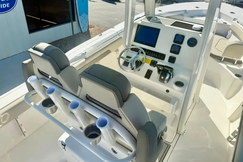 Slide: The Image of 2026 Key West 244 Center Console boat interior with modern helm and seating. - 53