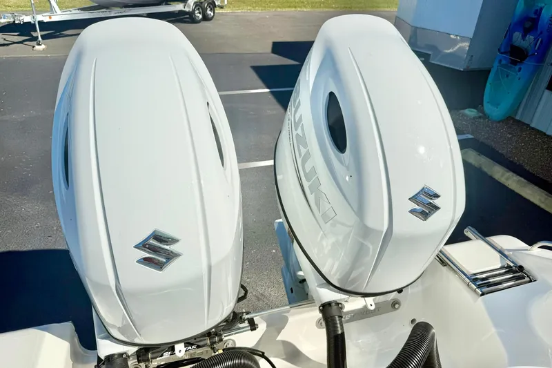 Slide: The Image of Twin Suzuki outboard engines on a 2026 Key West 244 Center Console boat. - 55