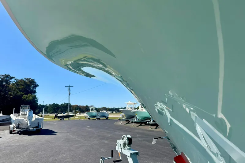 Slide: The Image of 2026 Key West 244 Center Console boat on trailer under clear blue sky. - 9