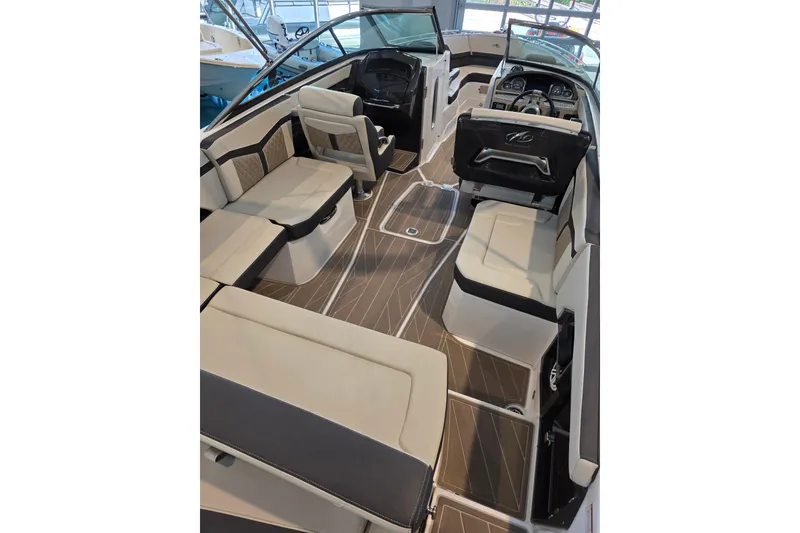 Slide: The Image of 2024 Monterey 275SS Super Sport boat interior with luxurious seating and modern dashboard. - 10