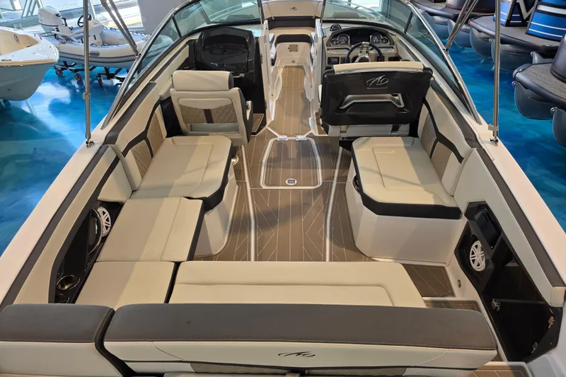 Slide: The Image of 2024 Monterey 275SS Super Sport boat interior with luxurious seating and modern dashboard. - 12
