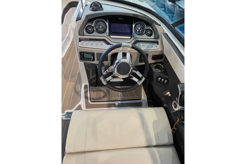Slide: The Image of 2024 Monterey 275SS Super Sport boat cockpit with modern steering and dashboard controls. - 13