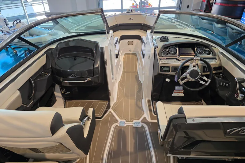 Slide: The Image of 2024 Monterey 275SS Super Sport boat interior with modern dashboard and seating. - 14