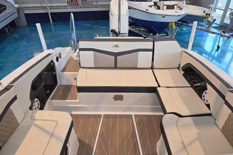 Slide: The Image of 2024 Monterey 275SS Super Sport boat interior with luxurious seating and modern design. - 18