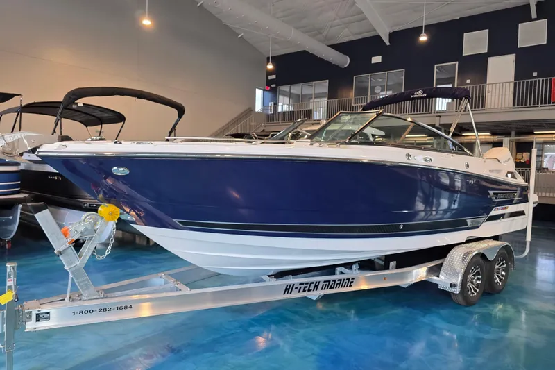 Slide: The Image of 2024 Monterey 275SS Super Sport boat on trailer in showroom. - 2