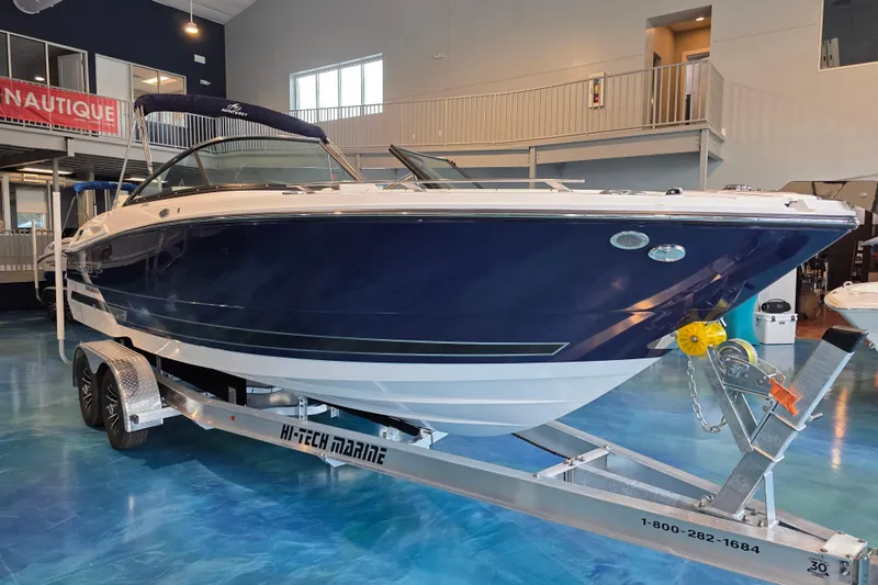 Slide: The Image of 2024 Monterey 275SS Super Sport boat on trailer in showroom. - 4