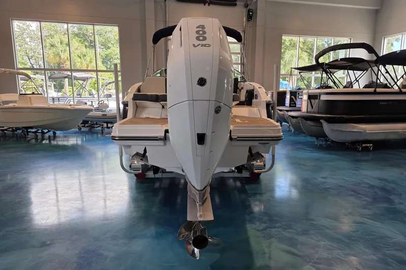 Slide: The Image of 2024 Monterey 275SS Super Sport boat in showroom, rear view with outboard motor. - 5