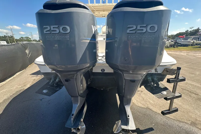 Slide: The Image of Twin Yamaha 250 four-stroke engines on a 2009 Scarab Sport 30 boat. - 14