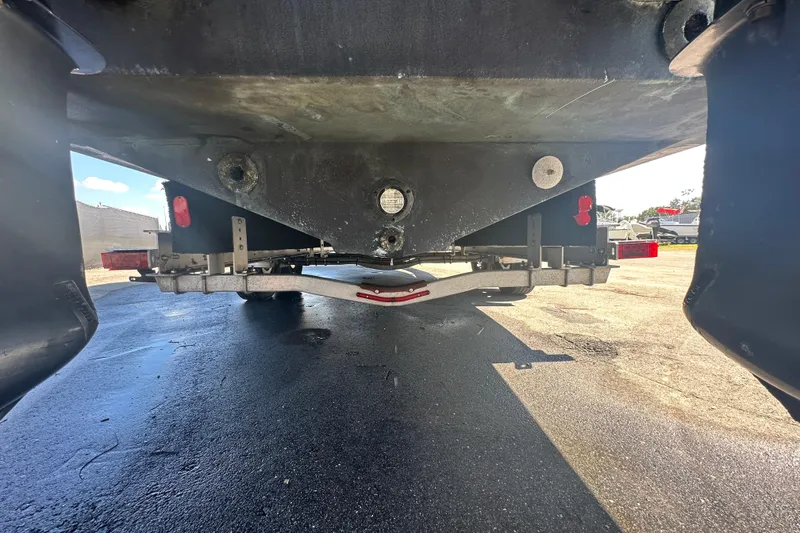 Slide: The Image of Underneath view of a 2009 Scarab Sport 30 boat on a trailer. - 16