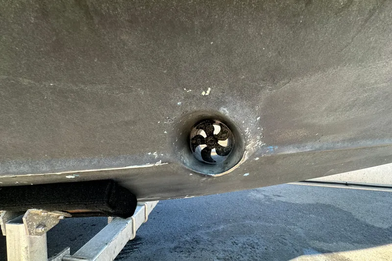 Slide: The Image of Bottom view of a 2009 Scarab Sport 30 boat on a trailer, showing the propeller. - 2