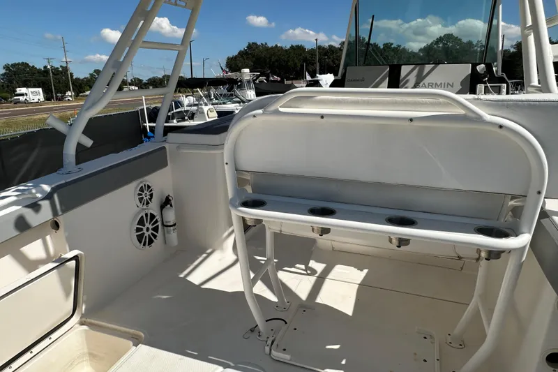 Slide: The Image of 2009 Scarab Sport 30 boat interior with rod holders and Garmin equipment. - 24