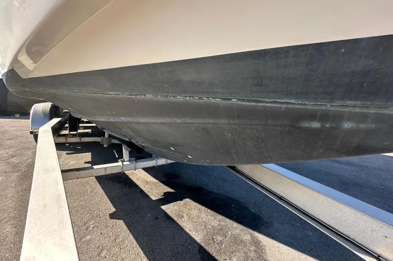Slide: The Image of 2009 Scarab Sport 30 boat hull on trailer, showing underside details. - 3