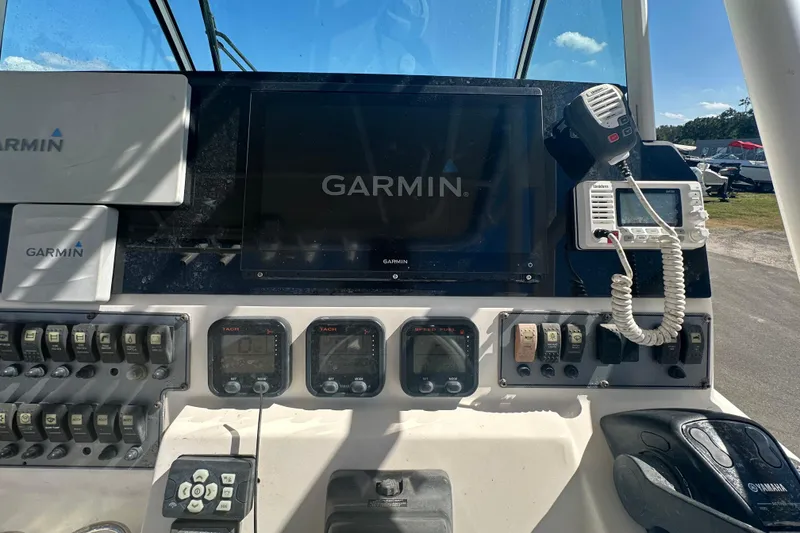 Slide: The Image of Control panel of a 2009 Scarab Sport 30 boat with Garmin navigation system. - 32