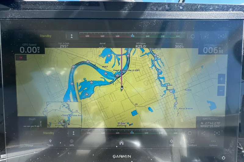 Slide: The Image of Garmin GPS display on 2009 Scarab Sport 30, showing detailed navigation map. - 33