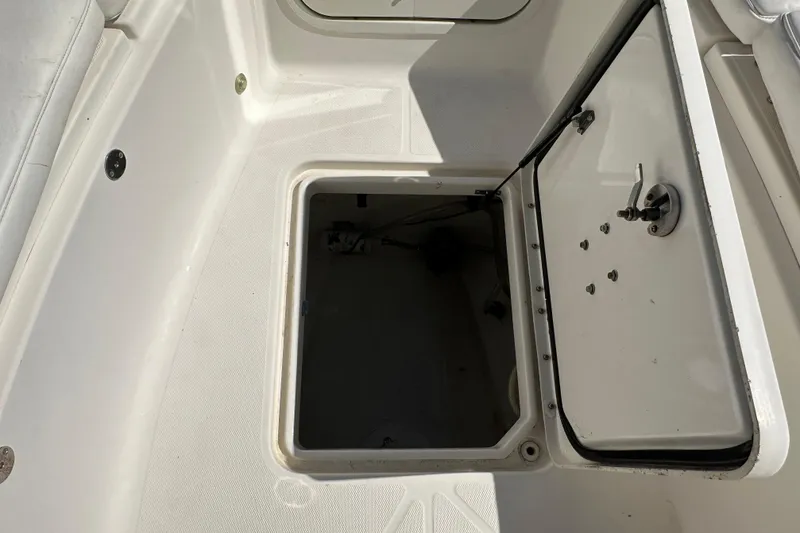 Slide: The Image of Open storage compartment on a 2009 Scarab Sport 30 boat, showing interior details. - 45