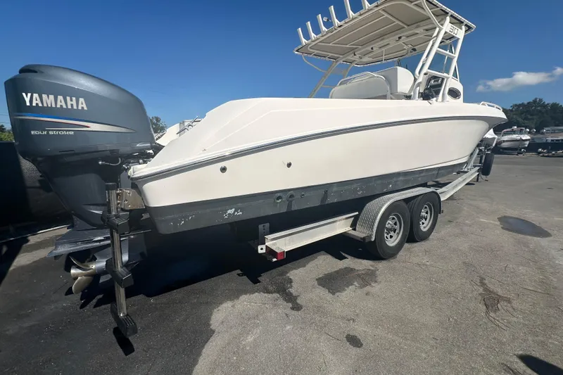 Slide: The Image of 2009 Scarab Sport 30 boat with Yamaha engine on trailer, parked outdoors. - 5