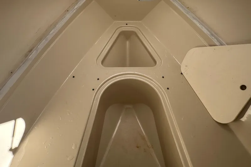 Slide: The Image of Interior view of a 2009 Scarab Sport 30 boat, showcasing storage compartments. - 53