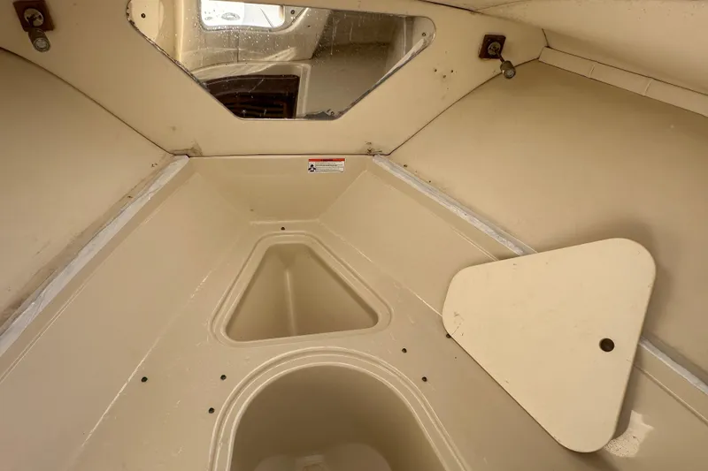 Slide: The Image of Interior view of 2009 Scarab Sport 30 boat cabin with storage compartments. - 54