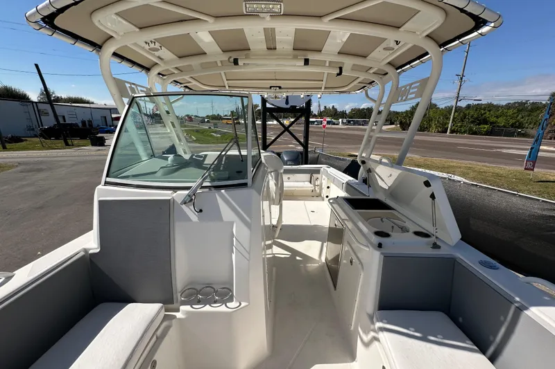Slide: The Image of 2009 Scarab Sport 30 boat interior with seating, windshield, and helm station. - 62