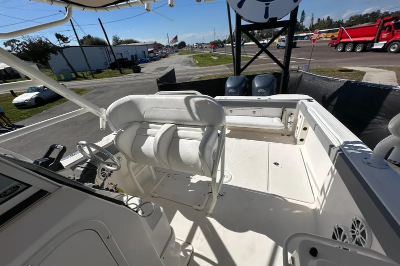 Slide: The Image of 2009 Scarab Sport 30 boat interior with dual engines and seating area. - 66