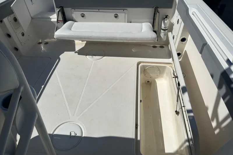 Slide: The Image of 2009 Scarab Sport 30 boat interior with seating and storage compartments. - 71