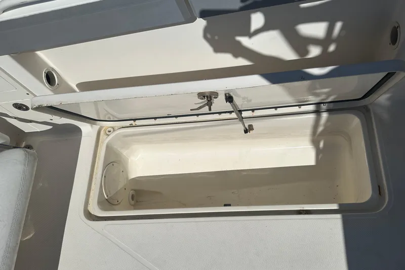 Slide: The Image of Open storage compartment on 2009 Scarab Sport 30 boat, showing interior details. - 72