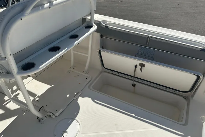 Slide: The Image of 2009 Scarab Sport 30 boat interior with storage compartments and seating area. - 73