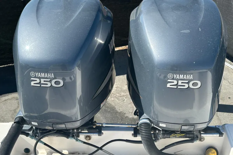 Slide: The Image of Twin Yamaha 250 outboard engines on a 2009 Scarab Sport 30 boat. - 77