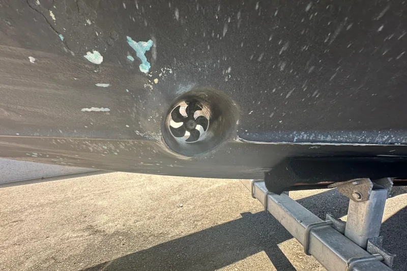 Slide: The Image of 2009 Scarab Sport 30 boat hull with visible propeller detail. - 9