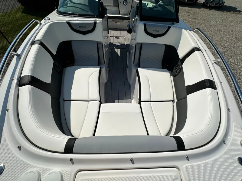 Slide: The Image of 2023 Chaparral 270 OSX boat interior with white and black seating. - 10