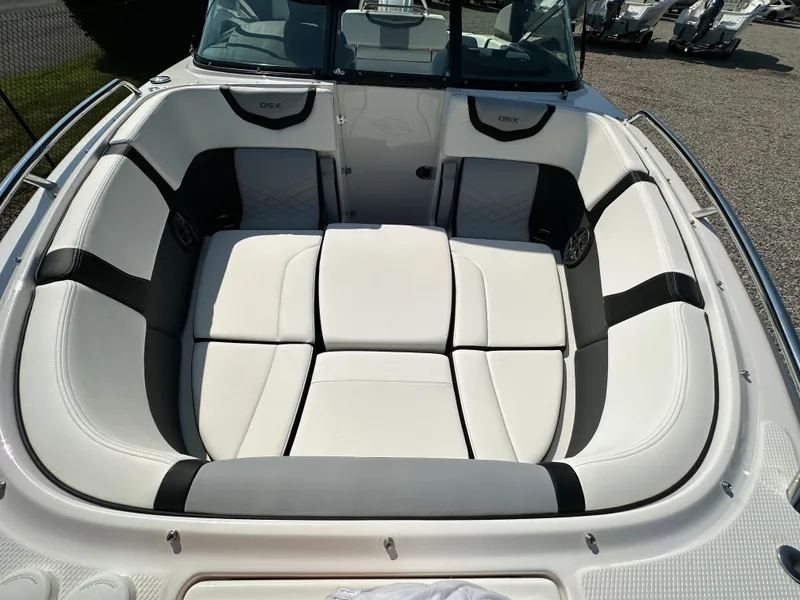 Slide: The Image of 2023 Chaparral 270 OSX boat interior with white cushioned seating. - 18
