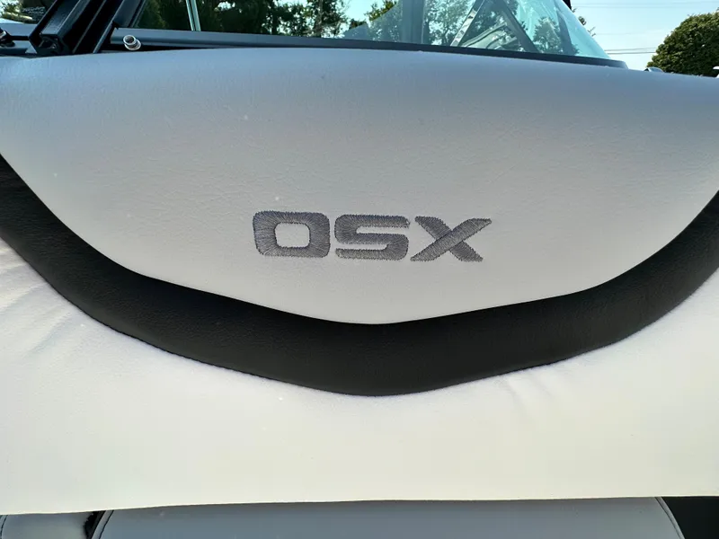 Slide: The Image of Chaparral 270 OSX 2023 boat seat with "OSX" logo in black and white. - 19
