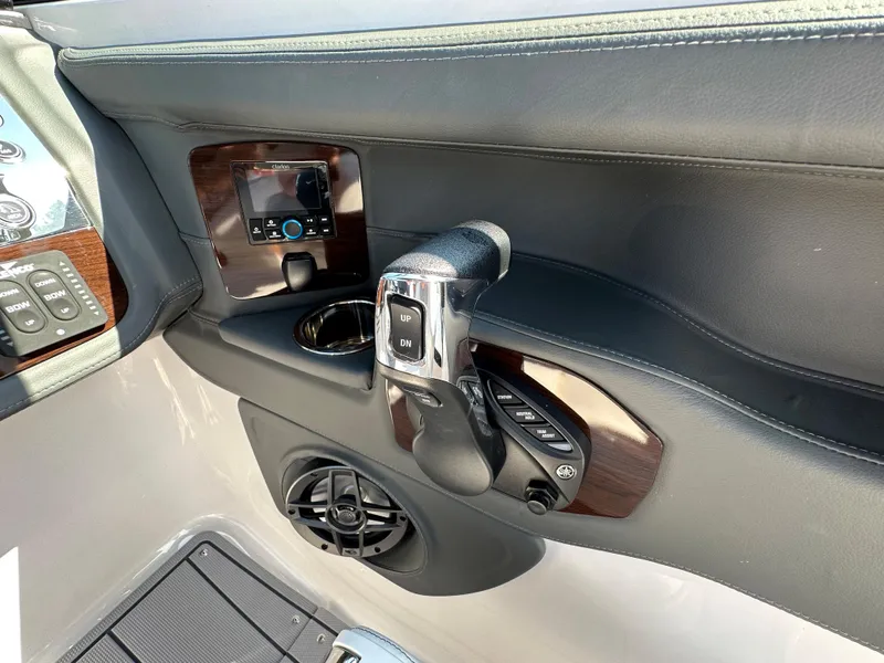 Slide: The Image of Control panel of 2023 Chaparral 270 OSX boat with throttle and speaker. - 27
