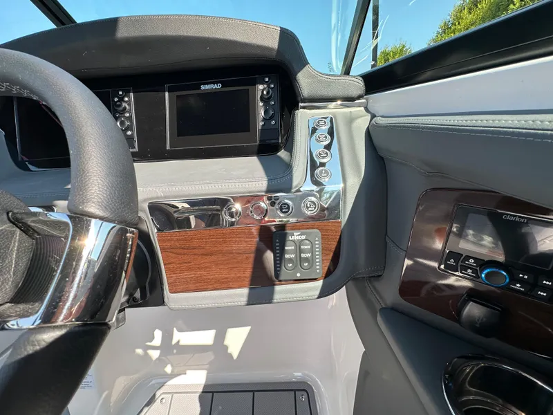 Slide: The Image of 2023 Chaparral 270 OSX dashboard with modern controls and navigation system. - 28