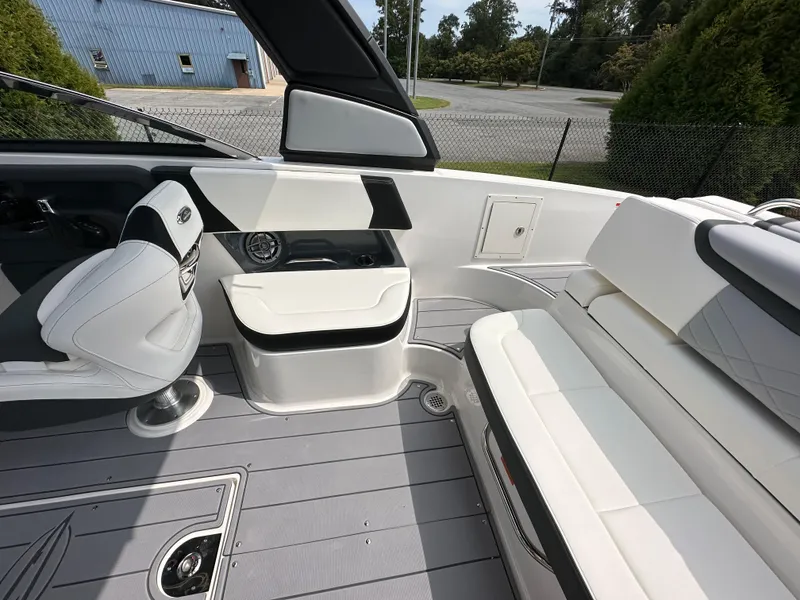 Slide: The Image of 2023 Chaparral 270 OSX boat interior with sleek seating and modern design. - 44