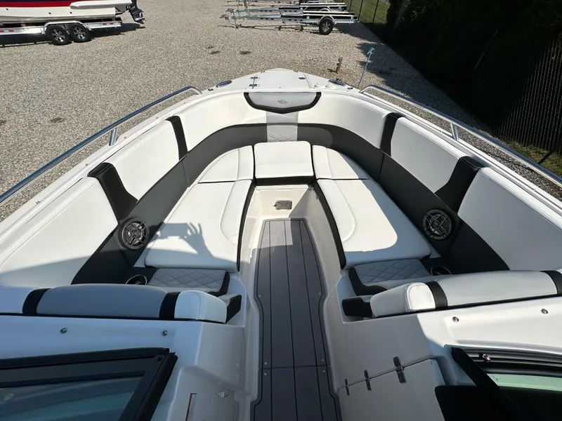 Slide: The Image of 2023 Chaparral 270 OSX boat interior with spacious seating and modern design. - 8